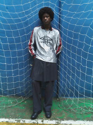 コグノーメン×アンブロのコラボウェア、“パロディロゴ入り”セットアップやシルバーのゲームシャツ|写真23