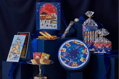 ヨックモック25年クリスマス限定クッキー＆シガール缶、“サンタや妖精”描いた年号入りデザイン