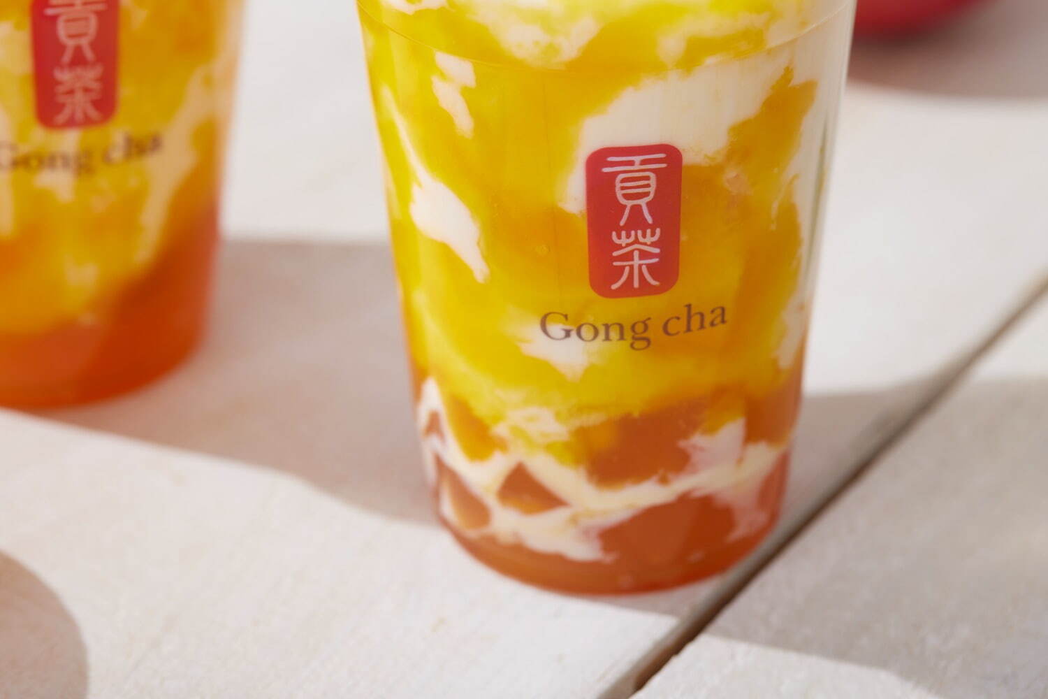 ゴンチャ(Gong cha) いよかんマンゴー ミルクティー＆フローズン｜写真4